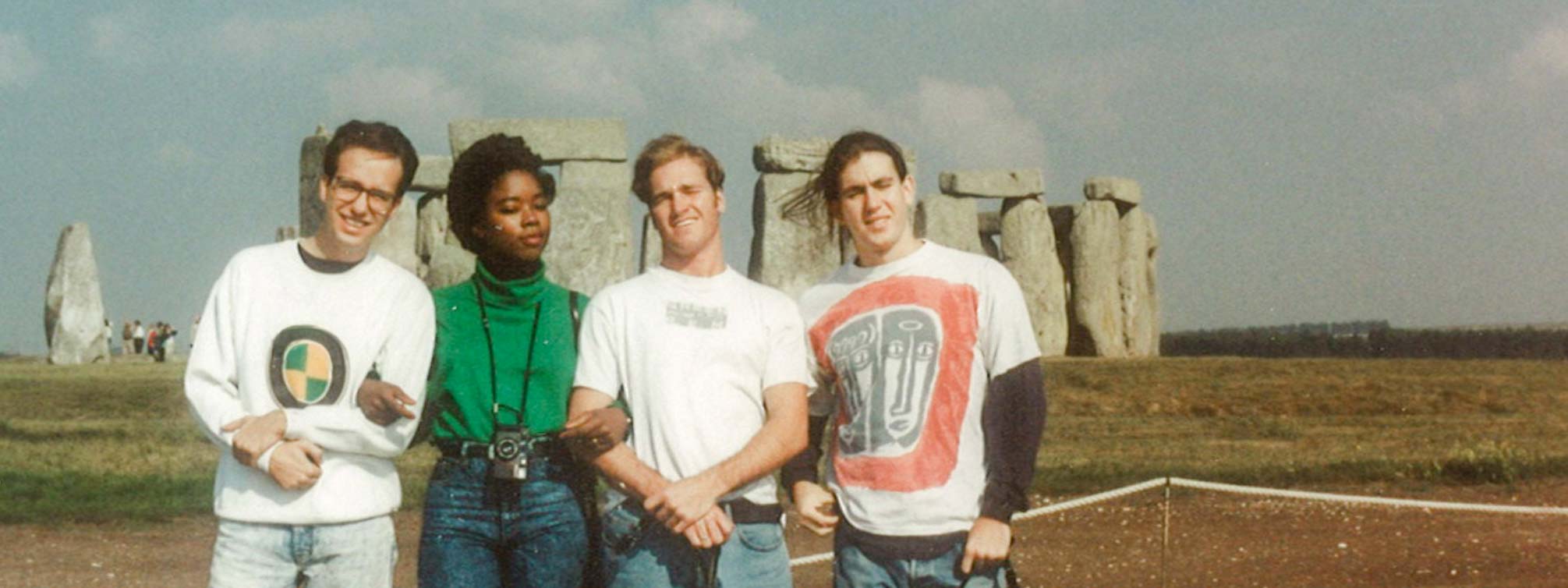 Four FSU students in the 90s pose in front of Stonehenge in the UK