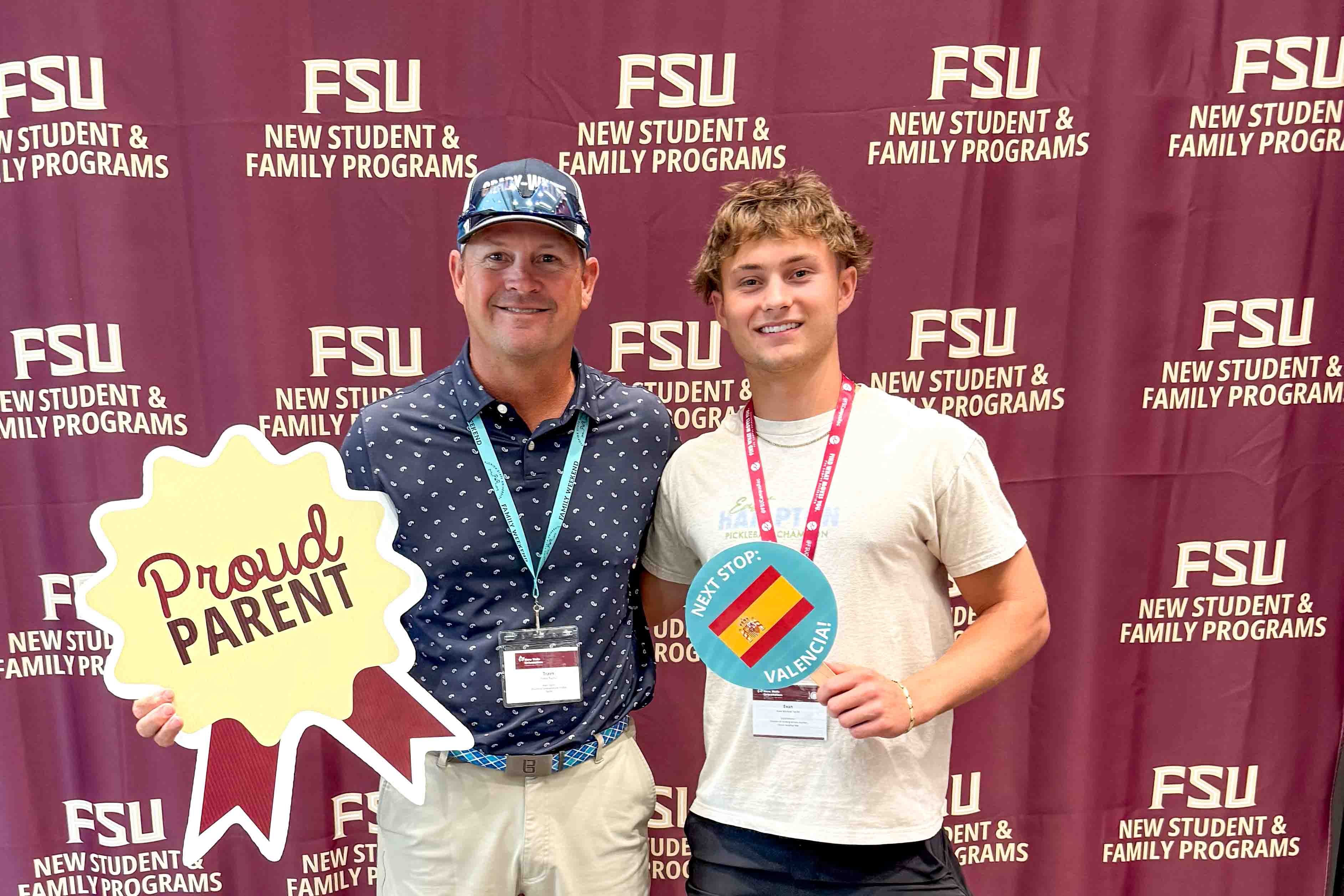 A dad and his son pose with a proud parent and next stop FSU Valencia sign.