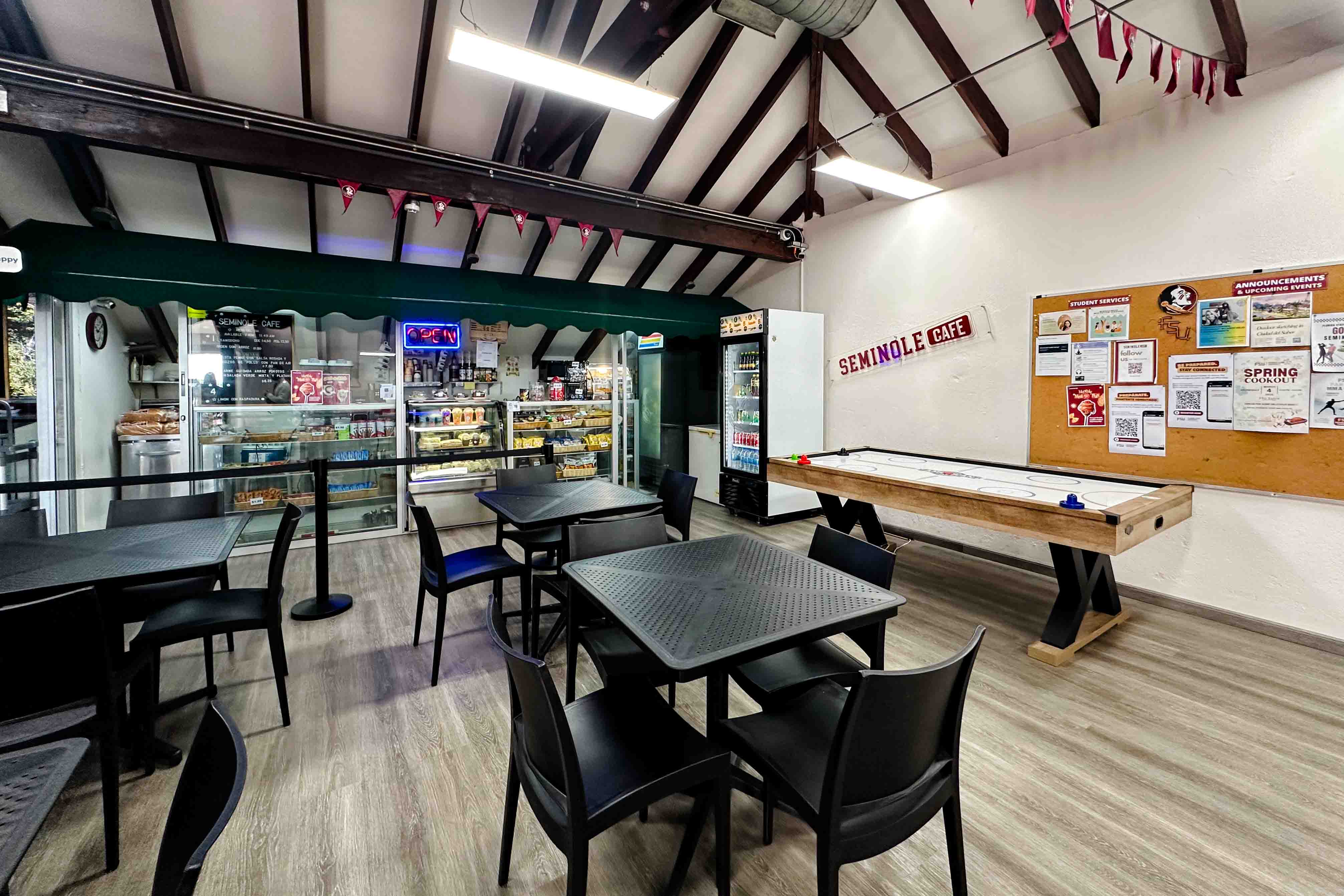 The café and lounge area has pool and air hockey tables and food options.