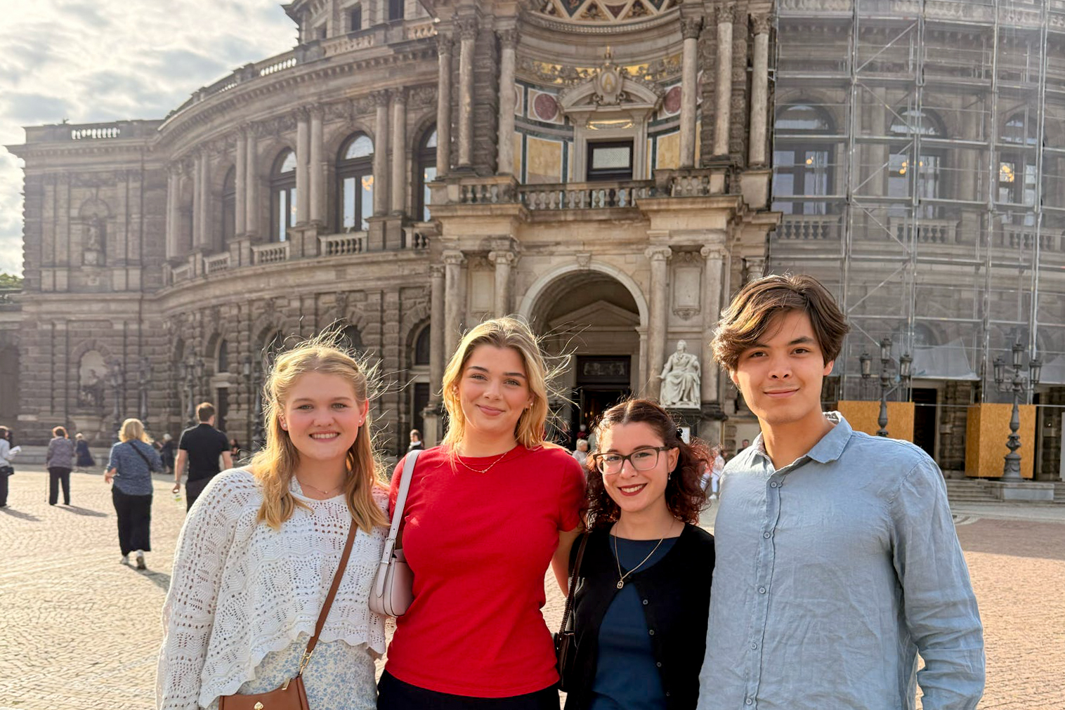 Students posing in front of a historic building in Dresden.