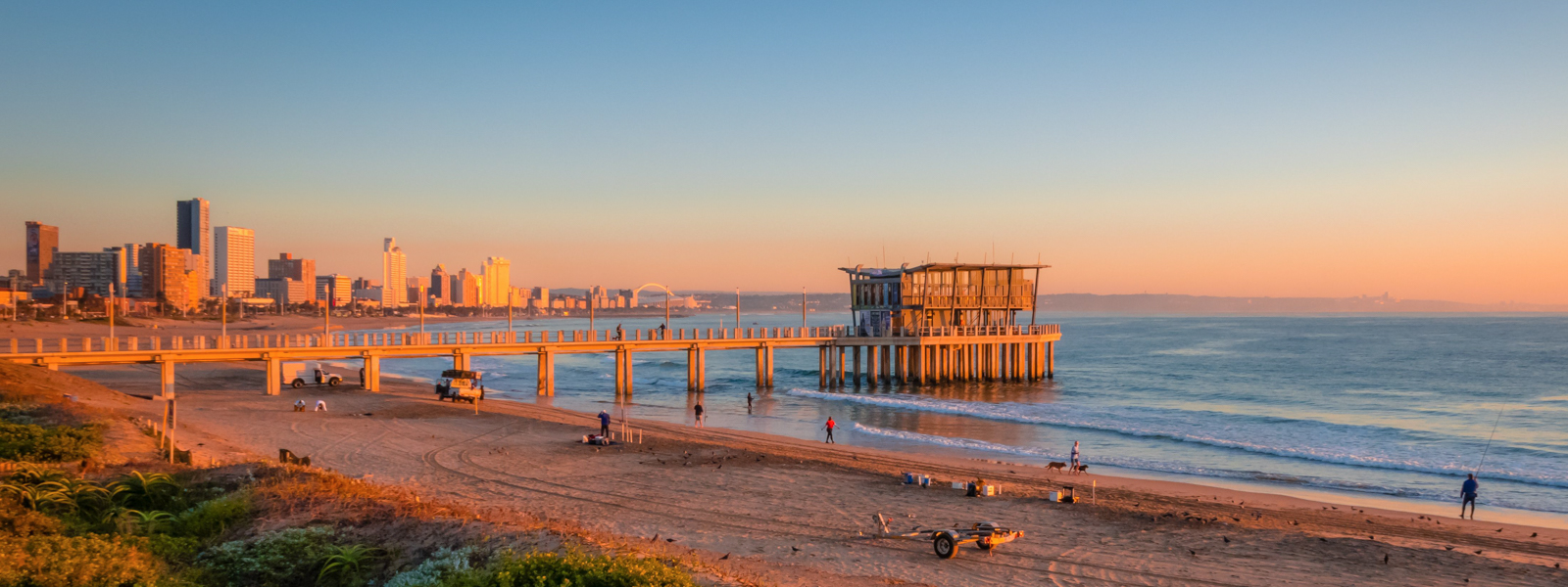 A view of a pier in Durban on the beach.