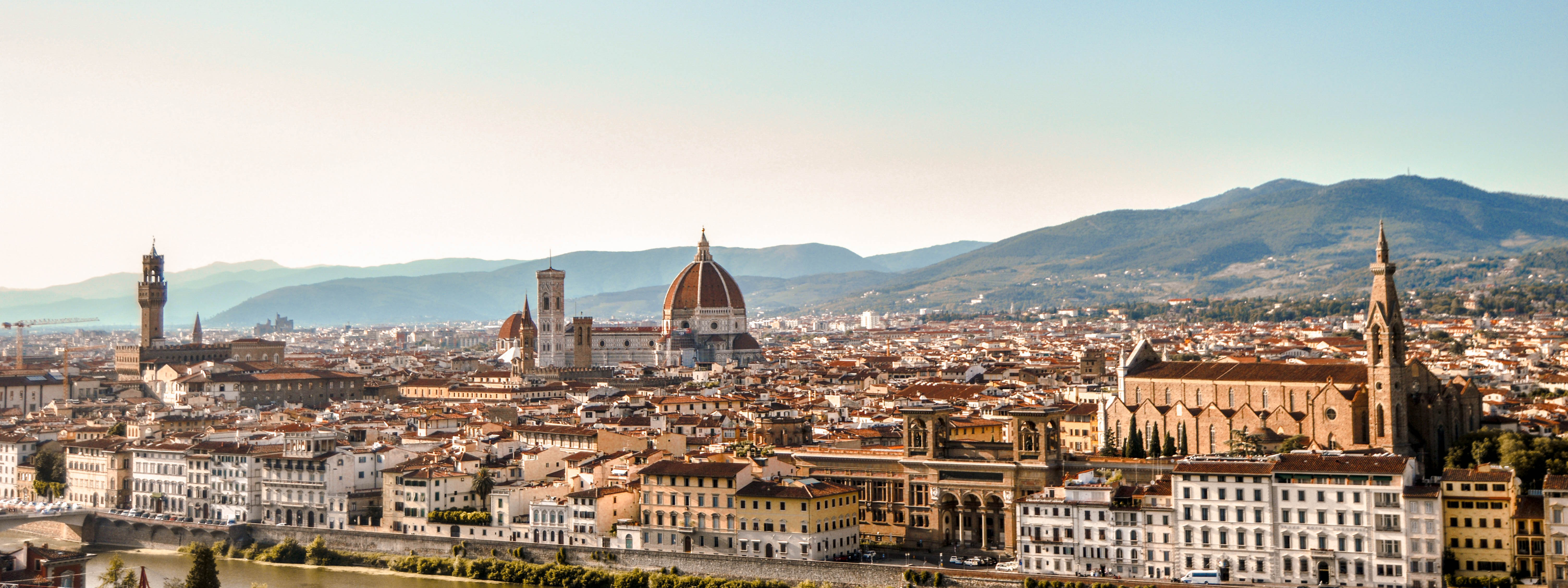 Florence's skyline with the Duomo and rolling hills in the background.