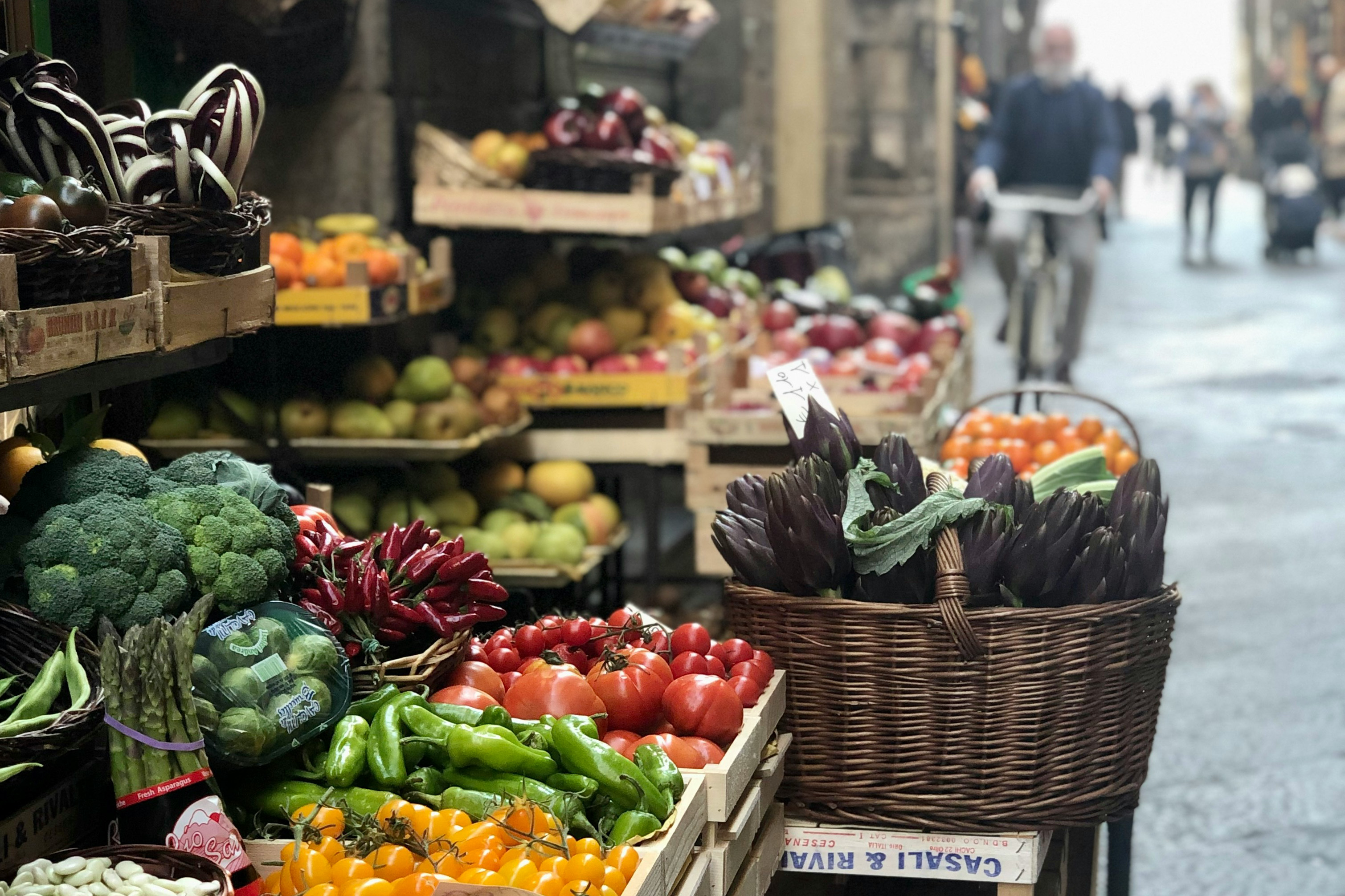 Vegetables in baskets in a market in Florence.