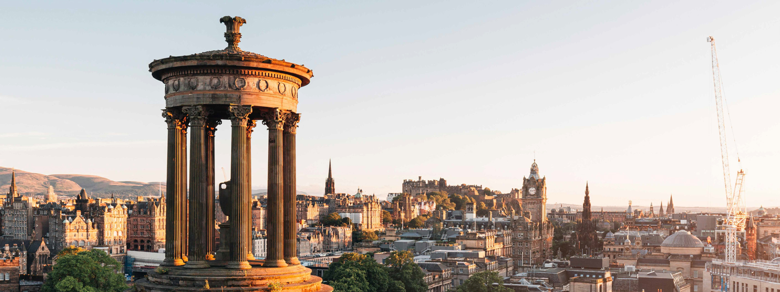 A view of a monument in a park in Edinburgh.