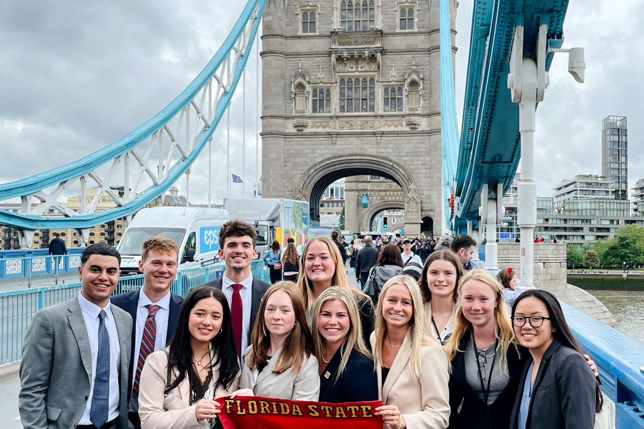 Students holding an FSU banner on Tower Bridge in London.