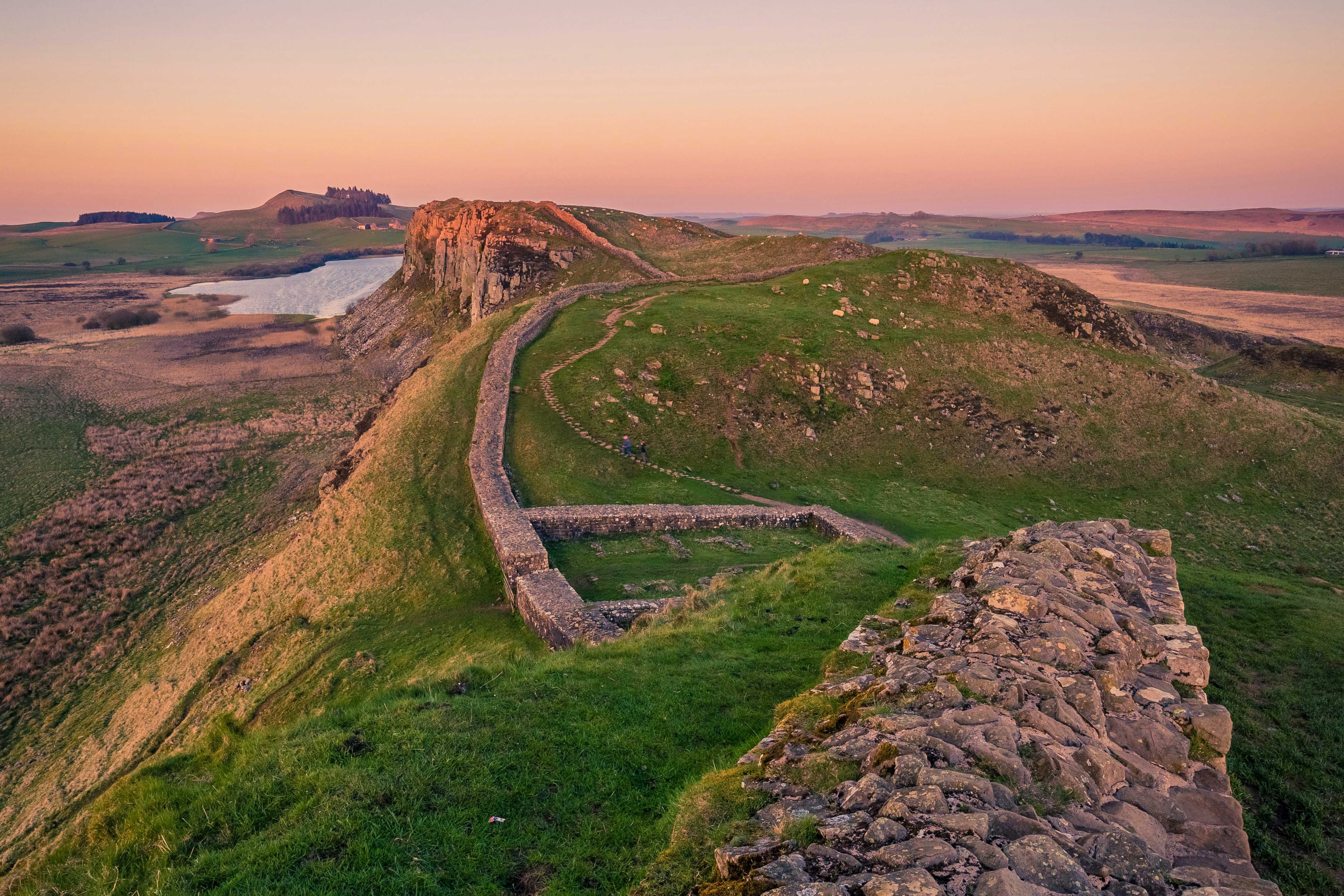 Hadrians Wall in pink light at sunset.