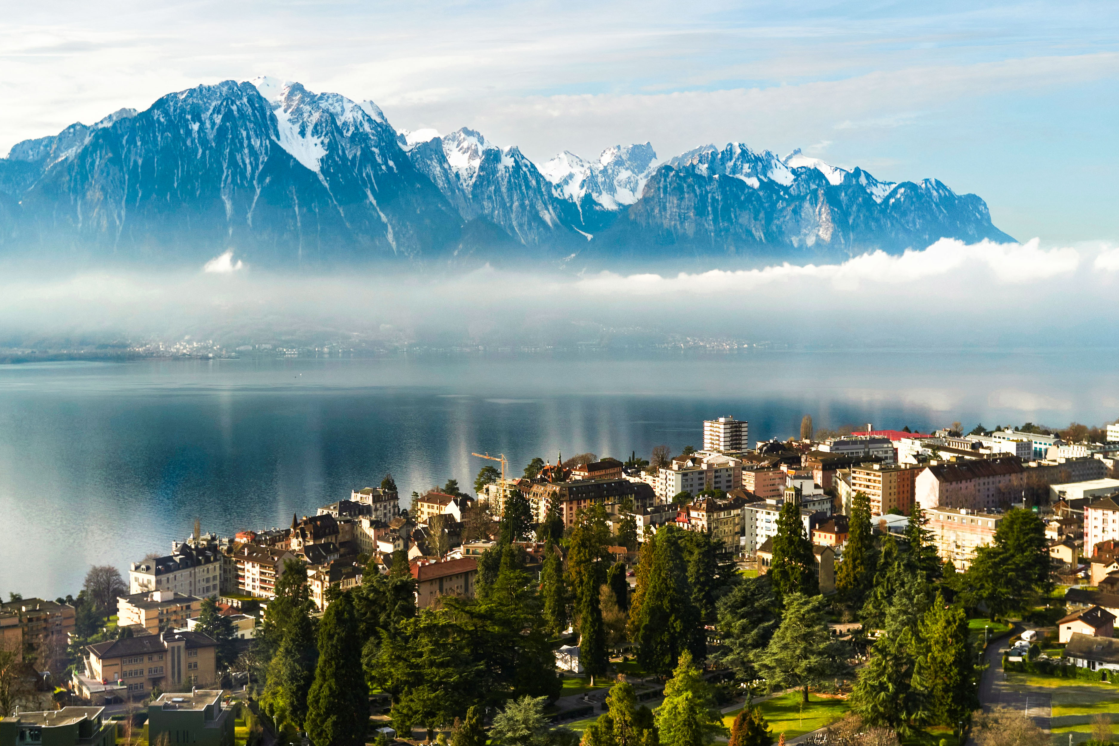 An aerial view of Montreux and its lake and mountains.
