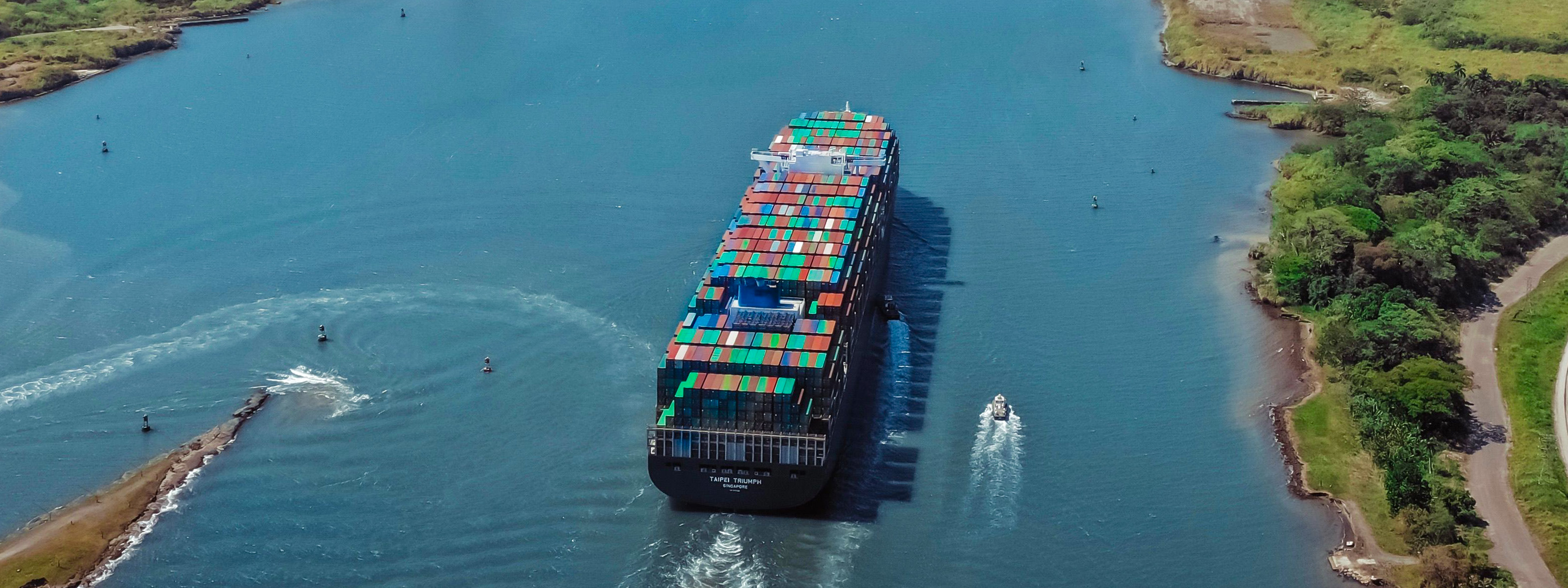 An aerial view of a boat in the Panama Canal. 