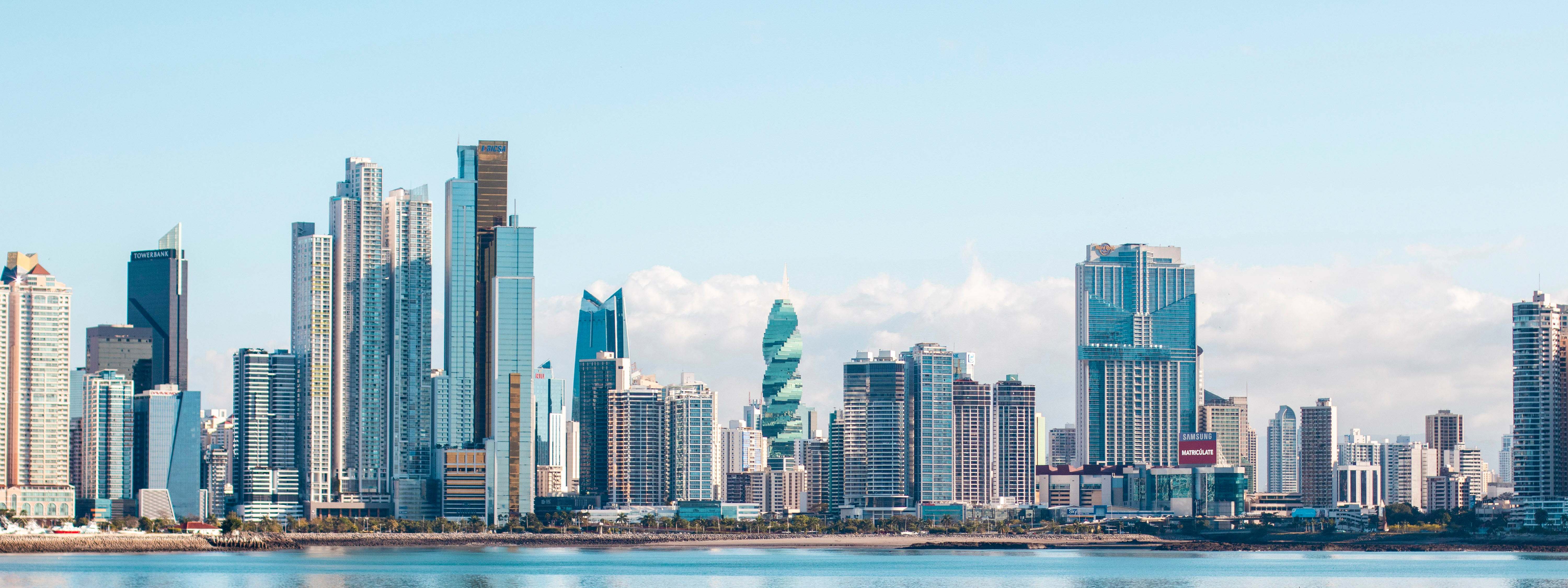 A view of buildings in front of water in downtown Panama City, Panama.