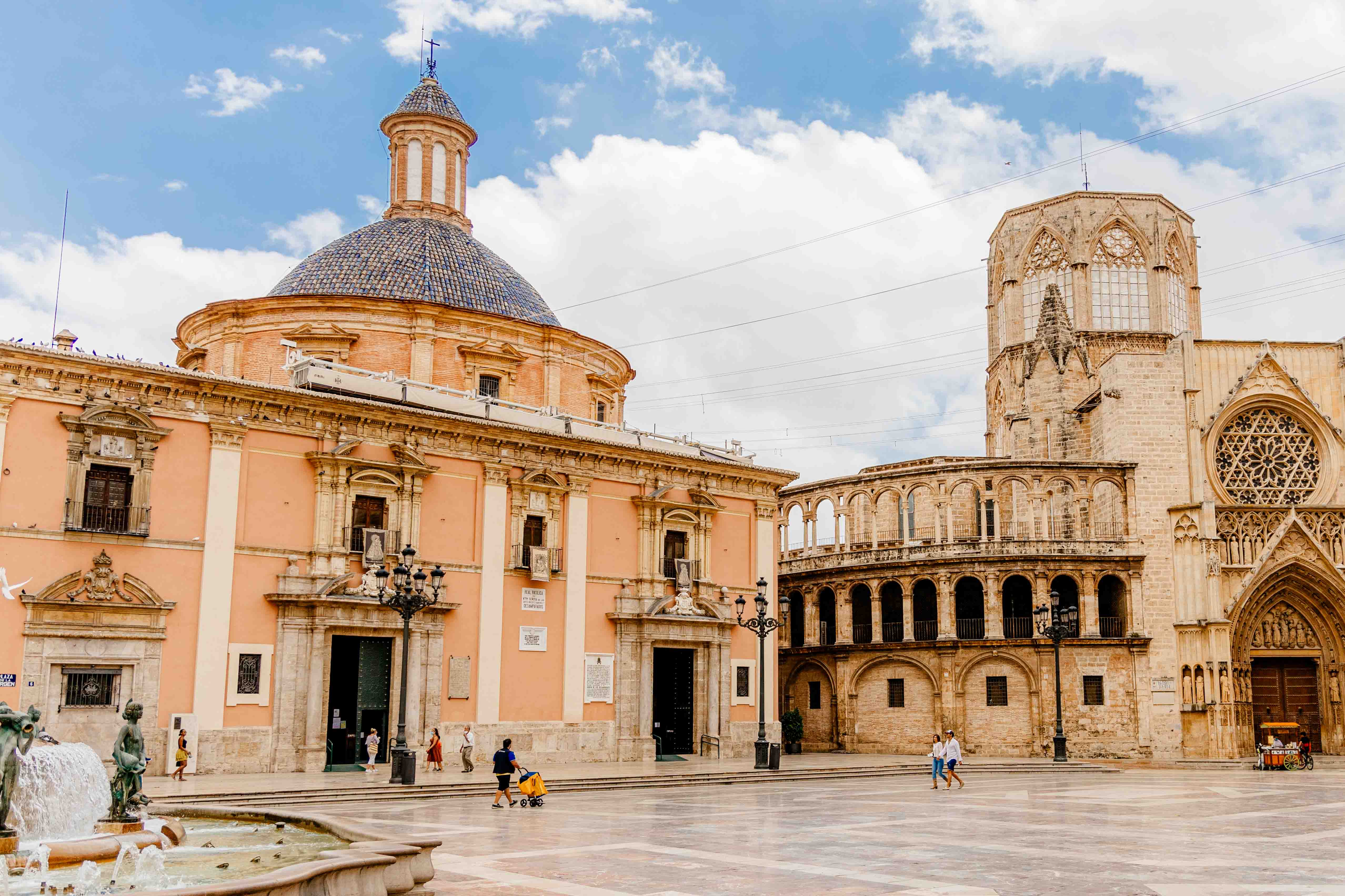 The basilica and cathedral are seen across the Plaza de la Virgen.
