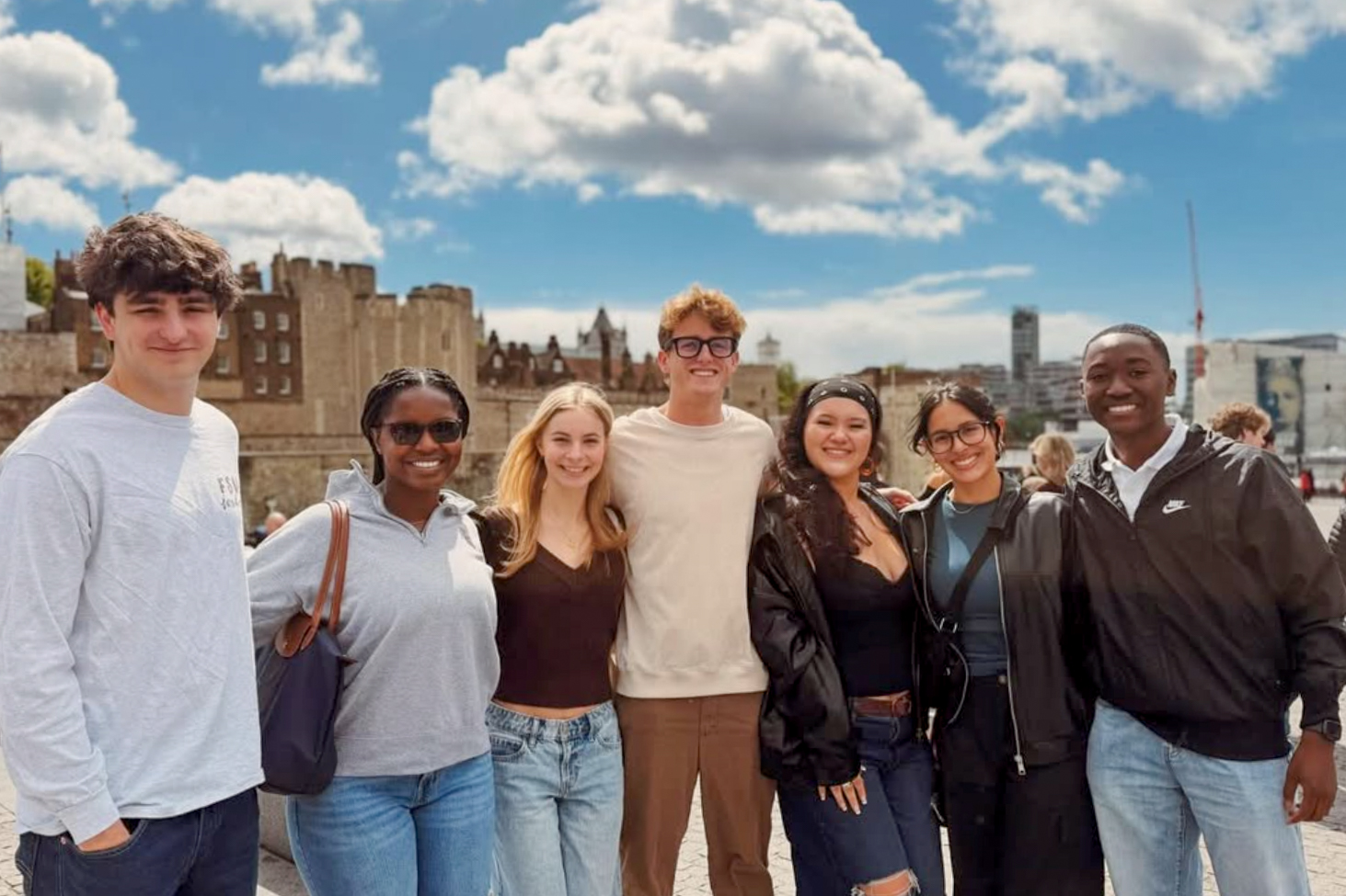 Students pose together smiling in London