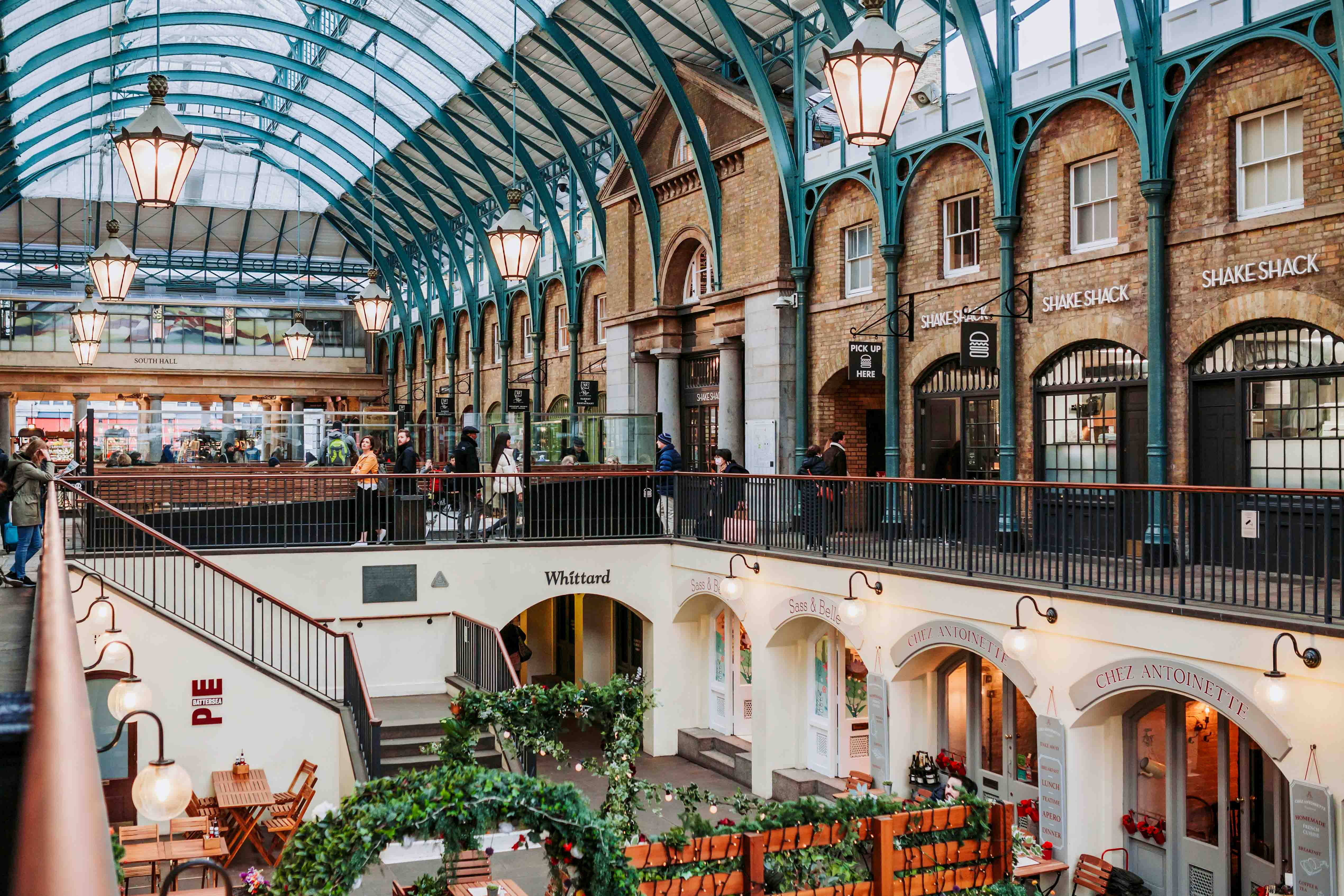 A view of the covered shopping area of Covent Garden in the West End.