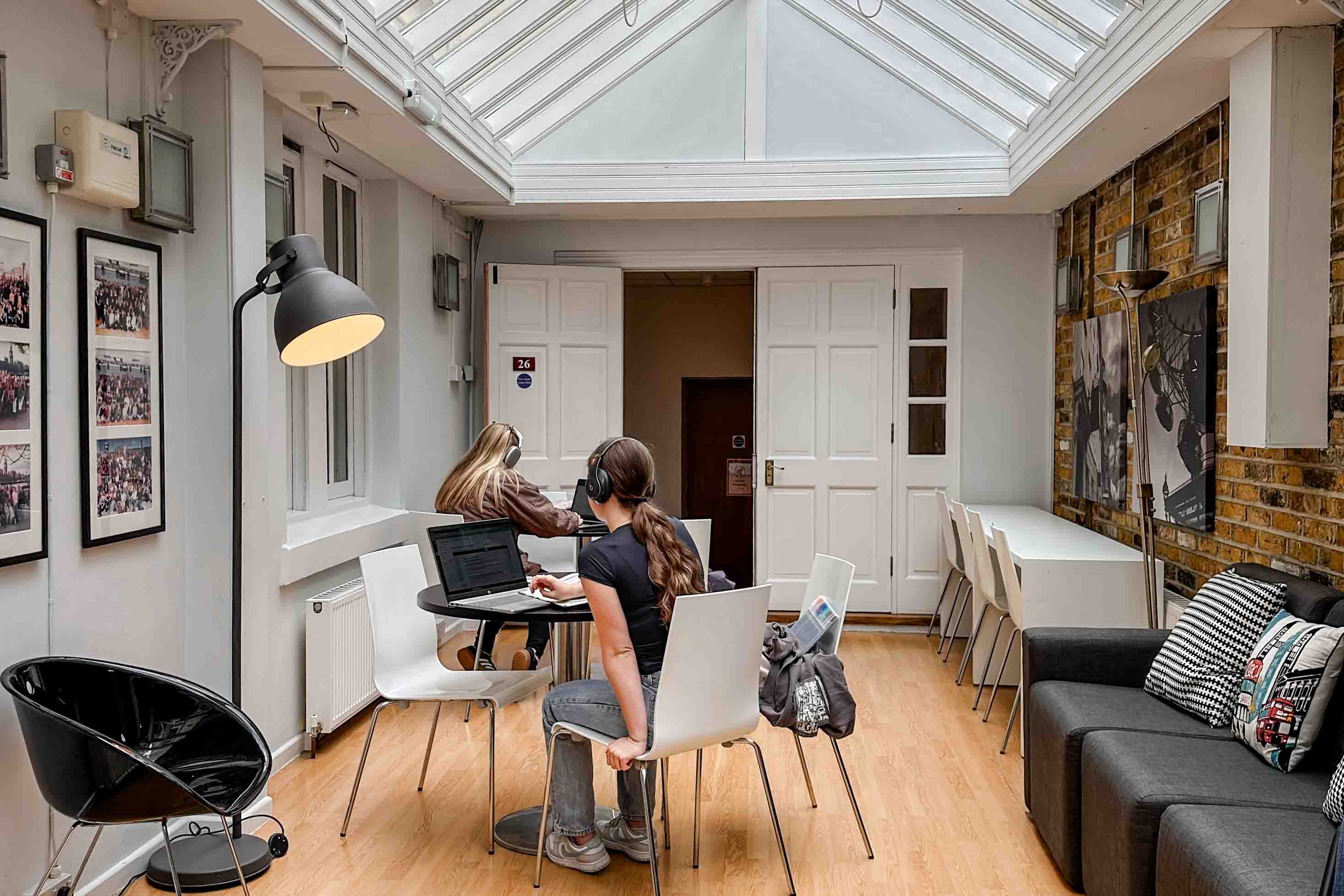 A view students studying in the glass ceiling conservatory at FSU London.