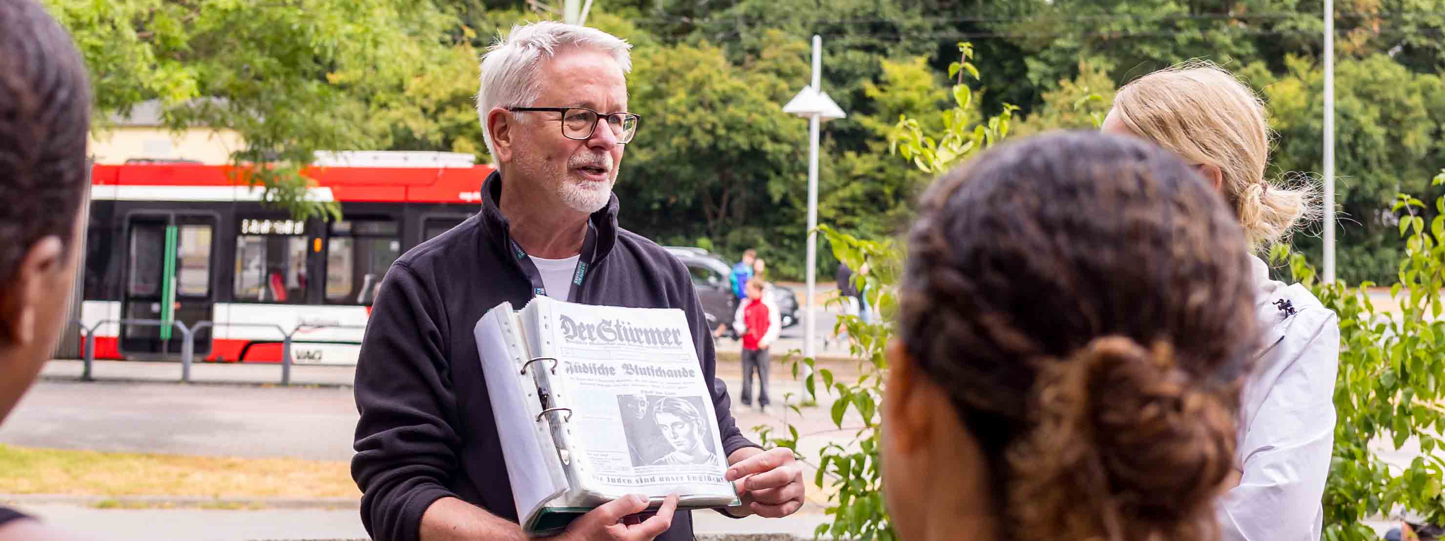A faculty member teaching students in Europe on a tour around the city.