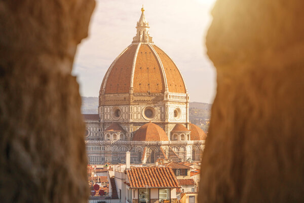 A view of the Duomo through stone walls.
