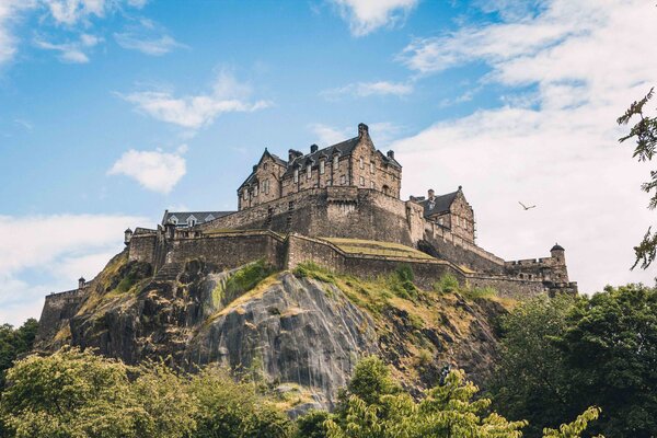 A view of Edinburgh Castle on a hill.