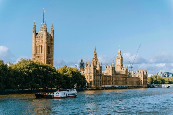 A view of the Houses of Parliament in London along the river Thames. 
