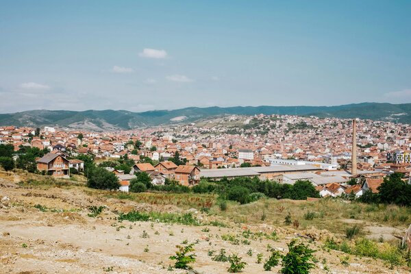 A view of houses from up on a hill in Pristina.